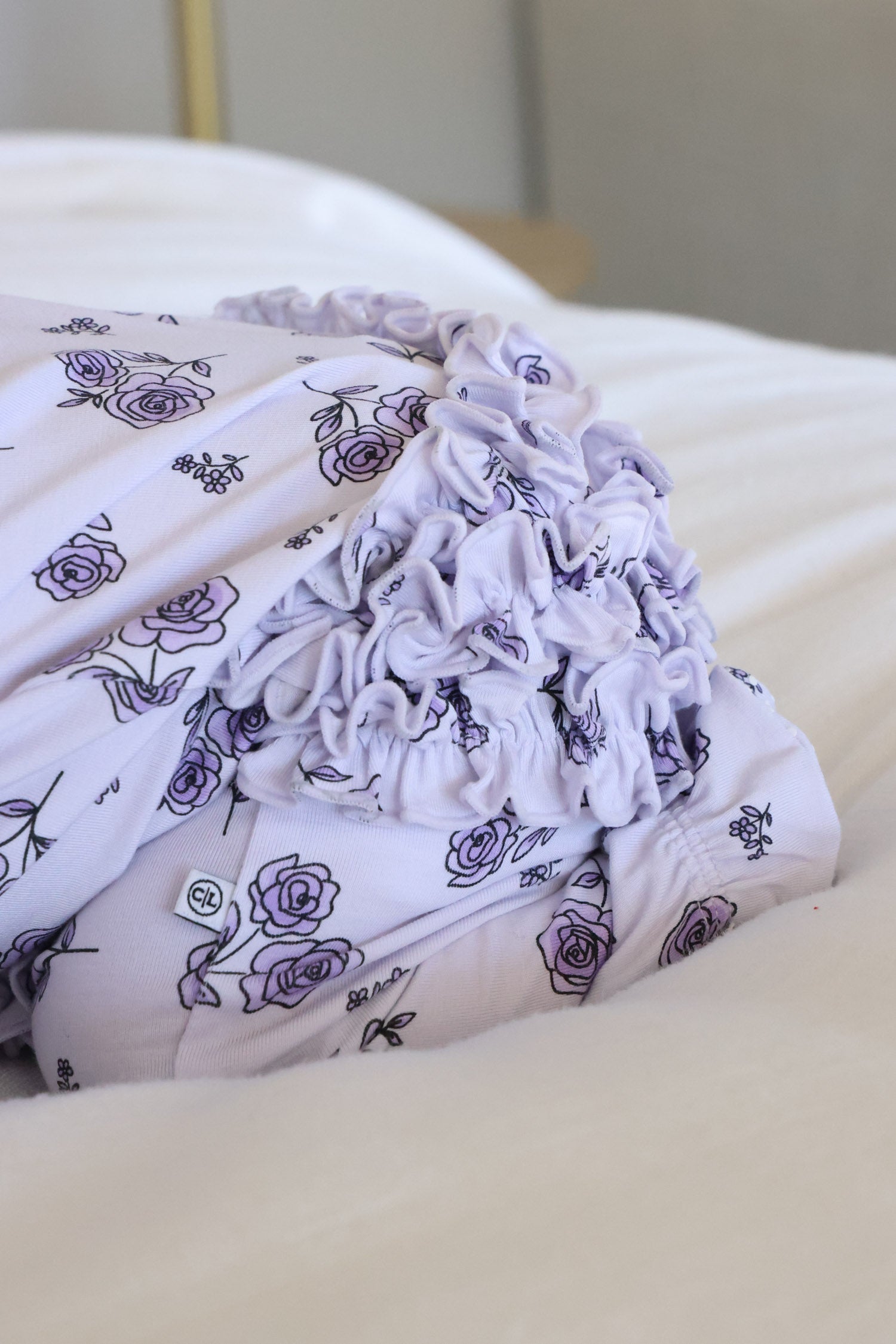 Ruffle Zipper Footie | Amethyst Garden
