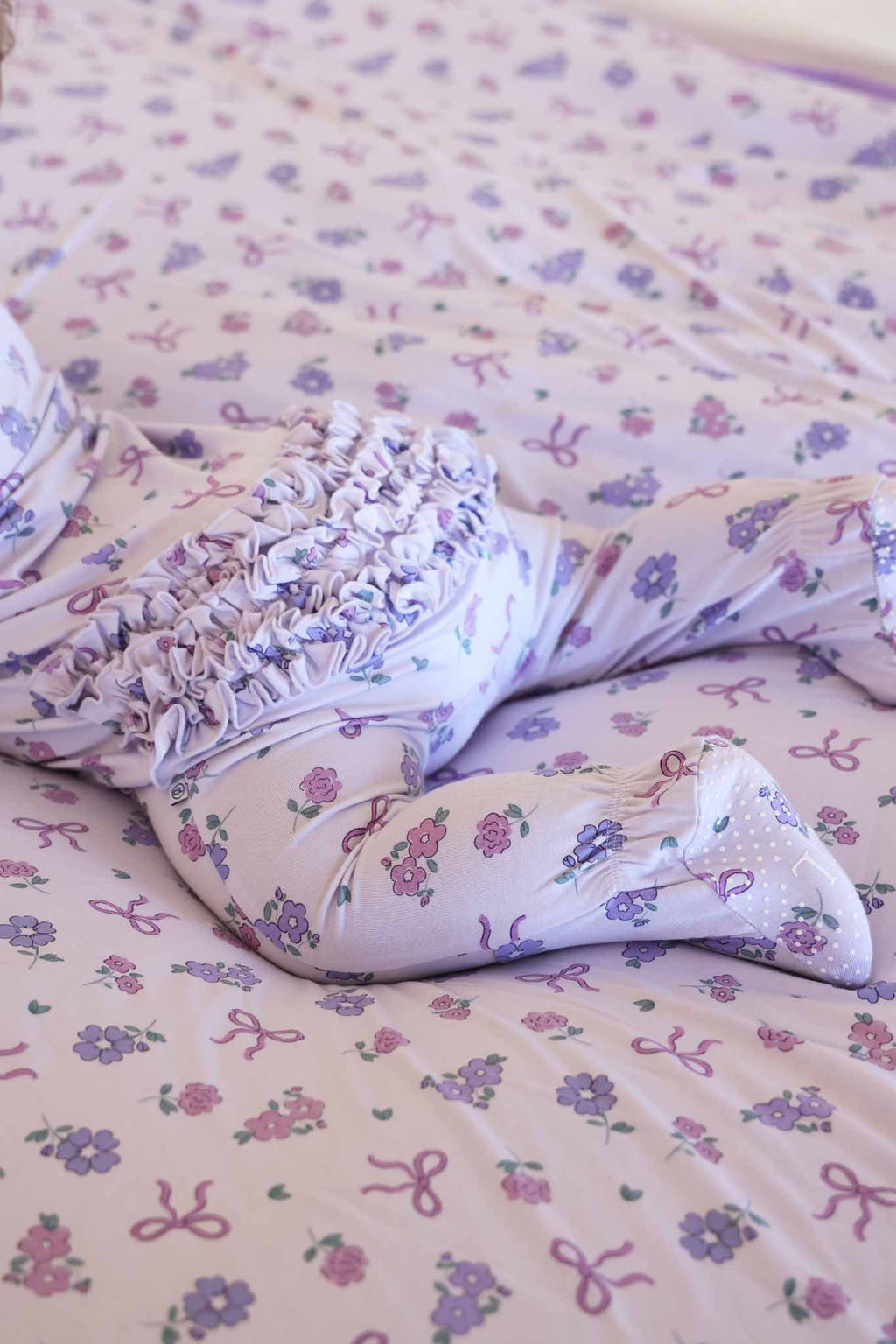 Ribbon & Roses Ruffle Zipper Footie | Purple